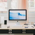 A clean and organized workspace featuring a computer with the DeskRest break reminder app open, promoting productivity and wellness.