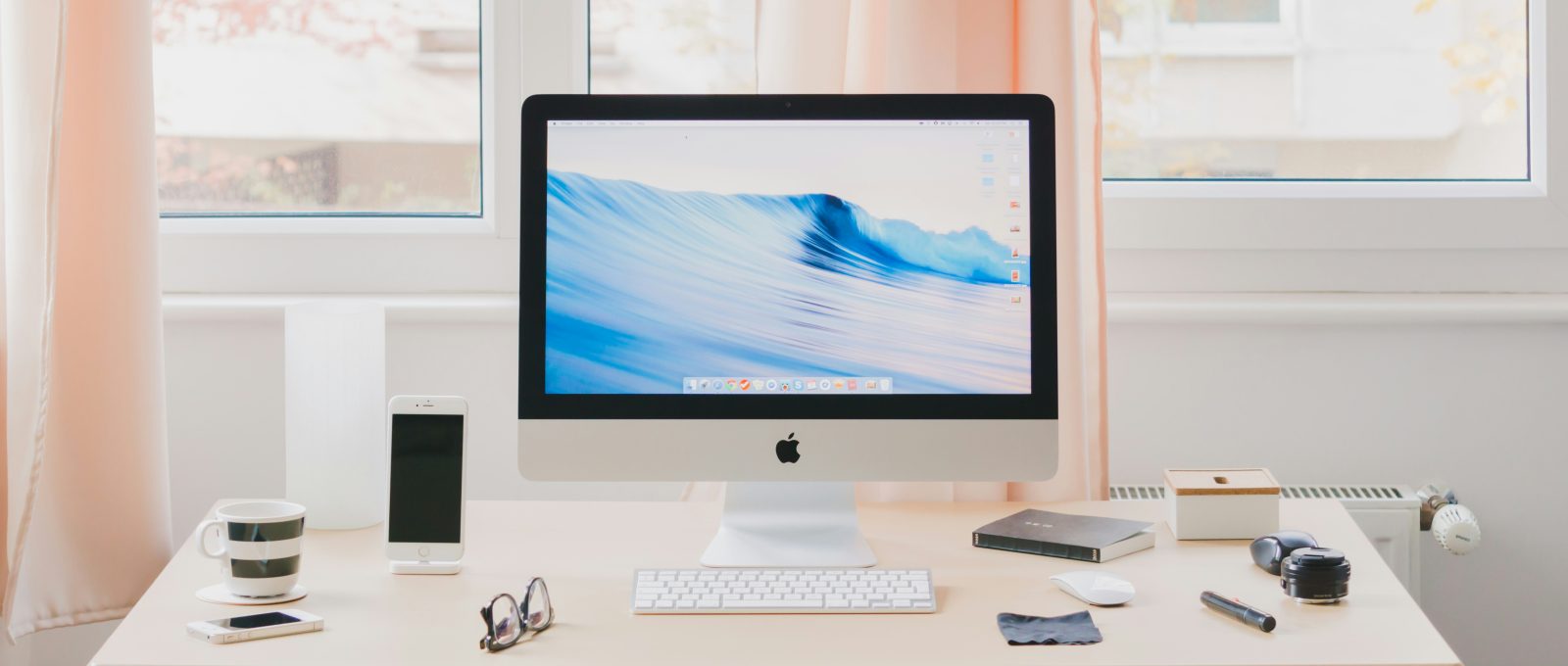 A clean and organized workspace featuring a computer with the DeskRest break reminder app open, promoting productivity and wellness.