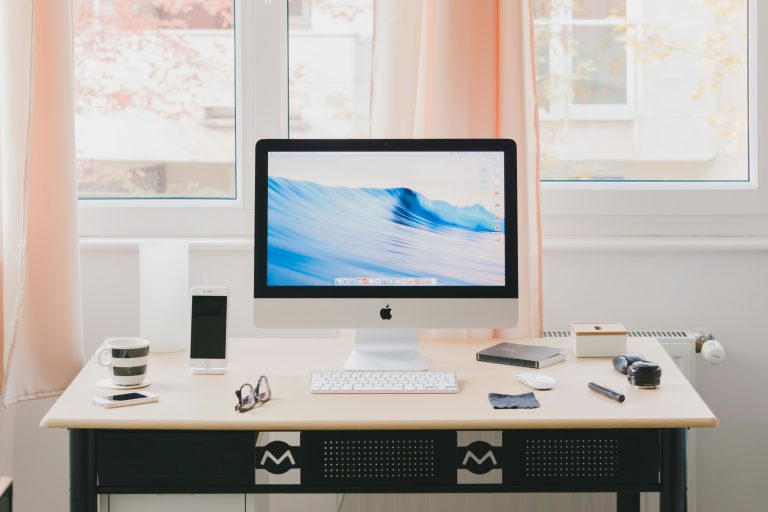 A clean and organized workspace featuring a computer with the DeskRest break reminder app open, promoting productivity and wellness.